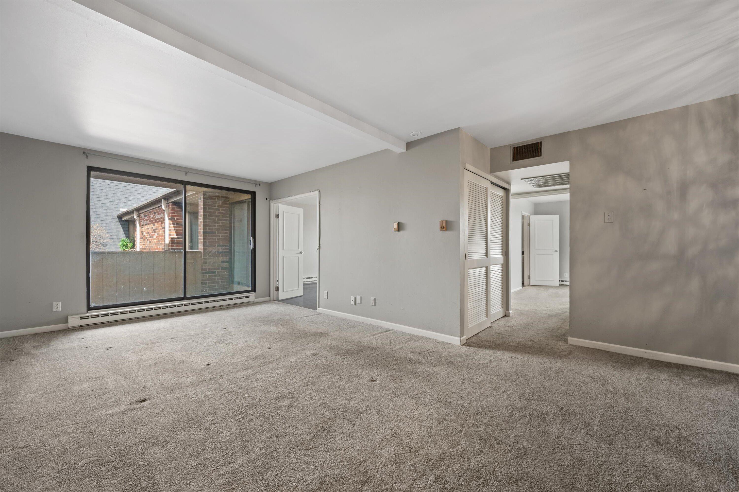 425 West Willow Court, Unit 222 Fox Point, WI 53217 - Photo 5 of 25 Living Room w/ Balcony Access