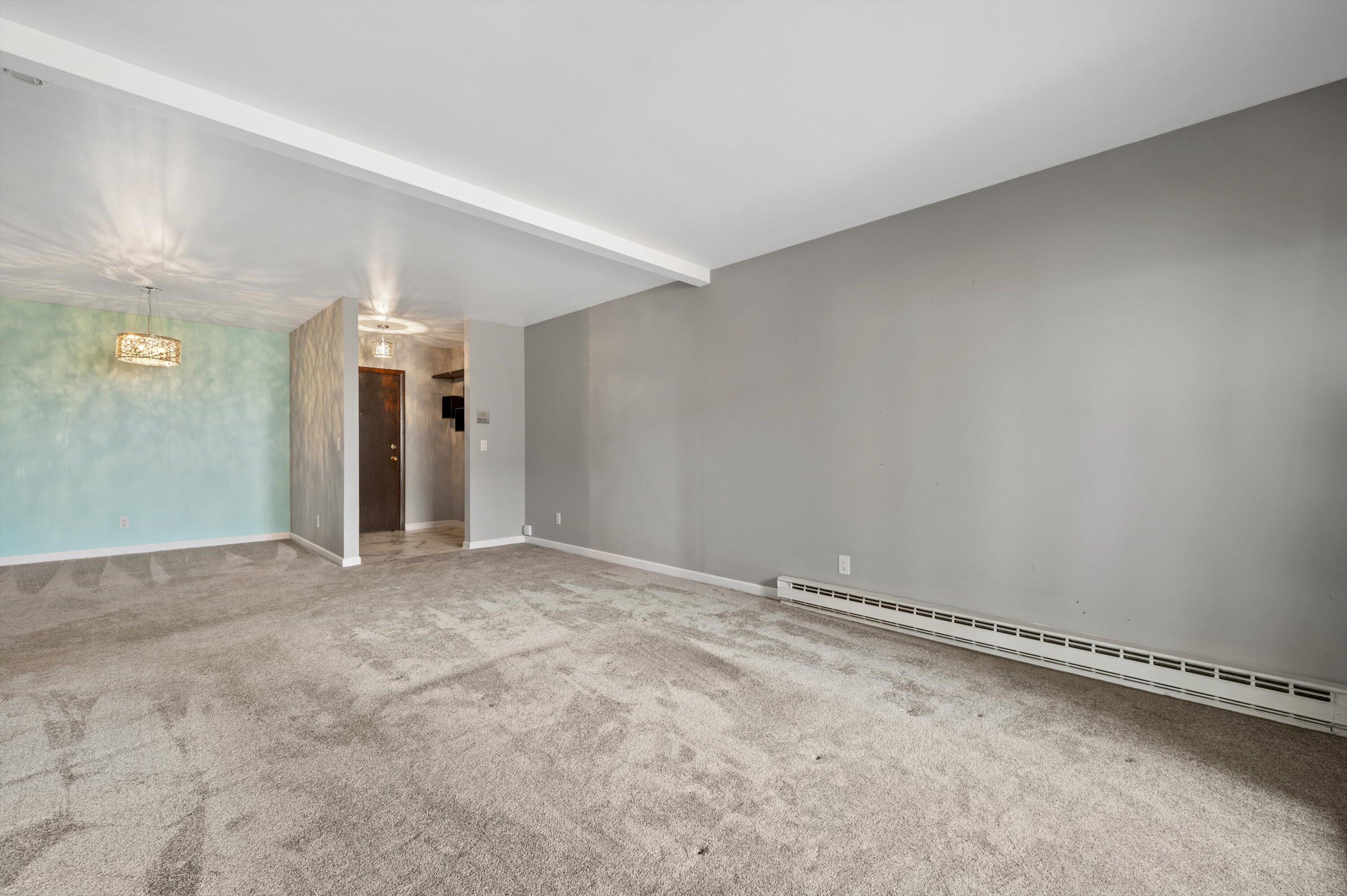 425 West Willow Court, Unit 222 Fox Point, WI 53217 - Photo 6 of 25 Living Room w/ Balcony Access
