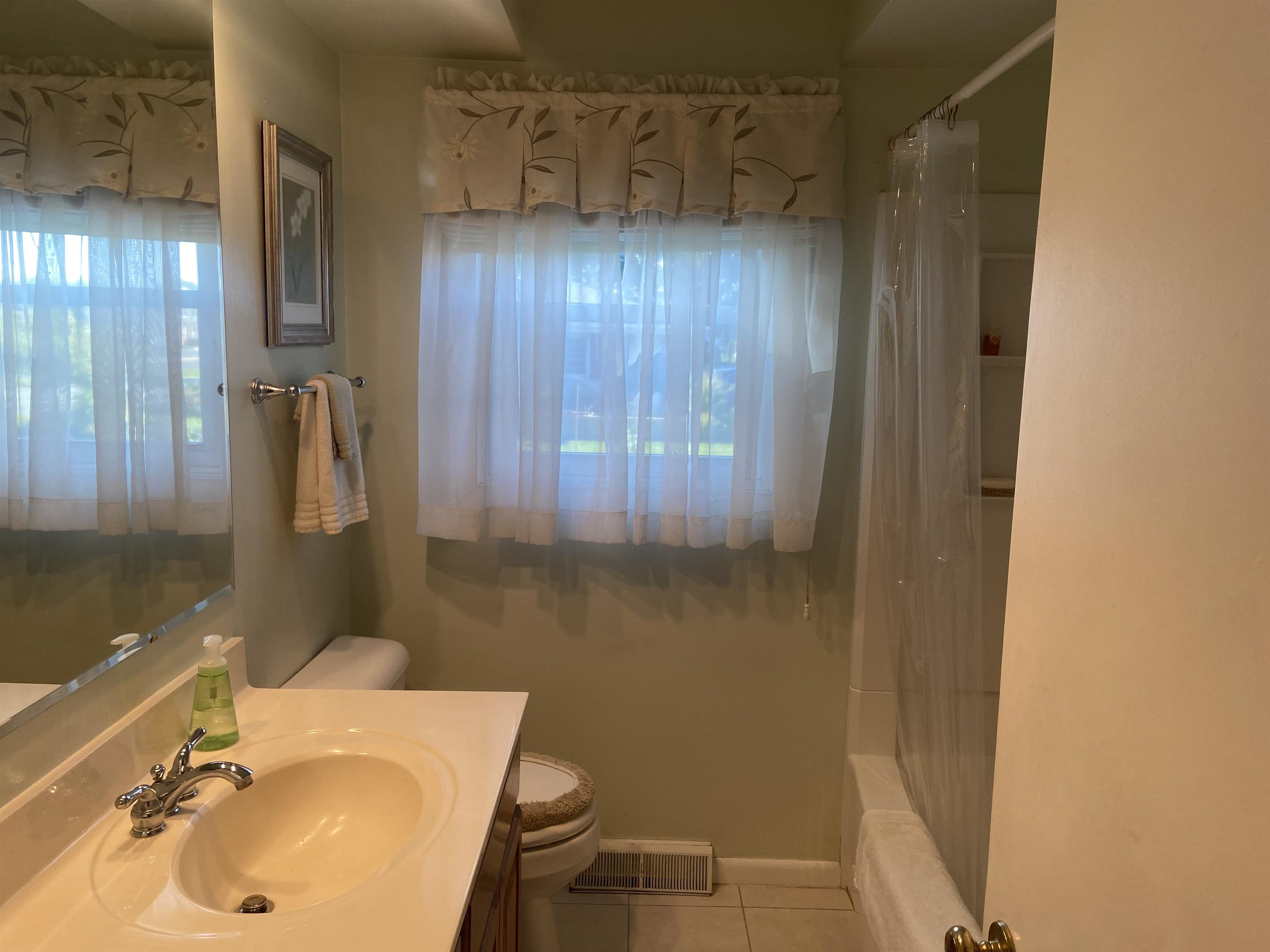 2006 South Alpine Road Rockford, IL 61108 - Photo 15 of 15 a bathroom with a sink toilet and shower