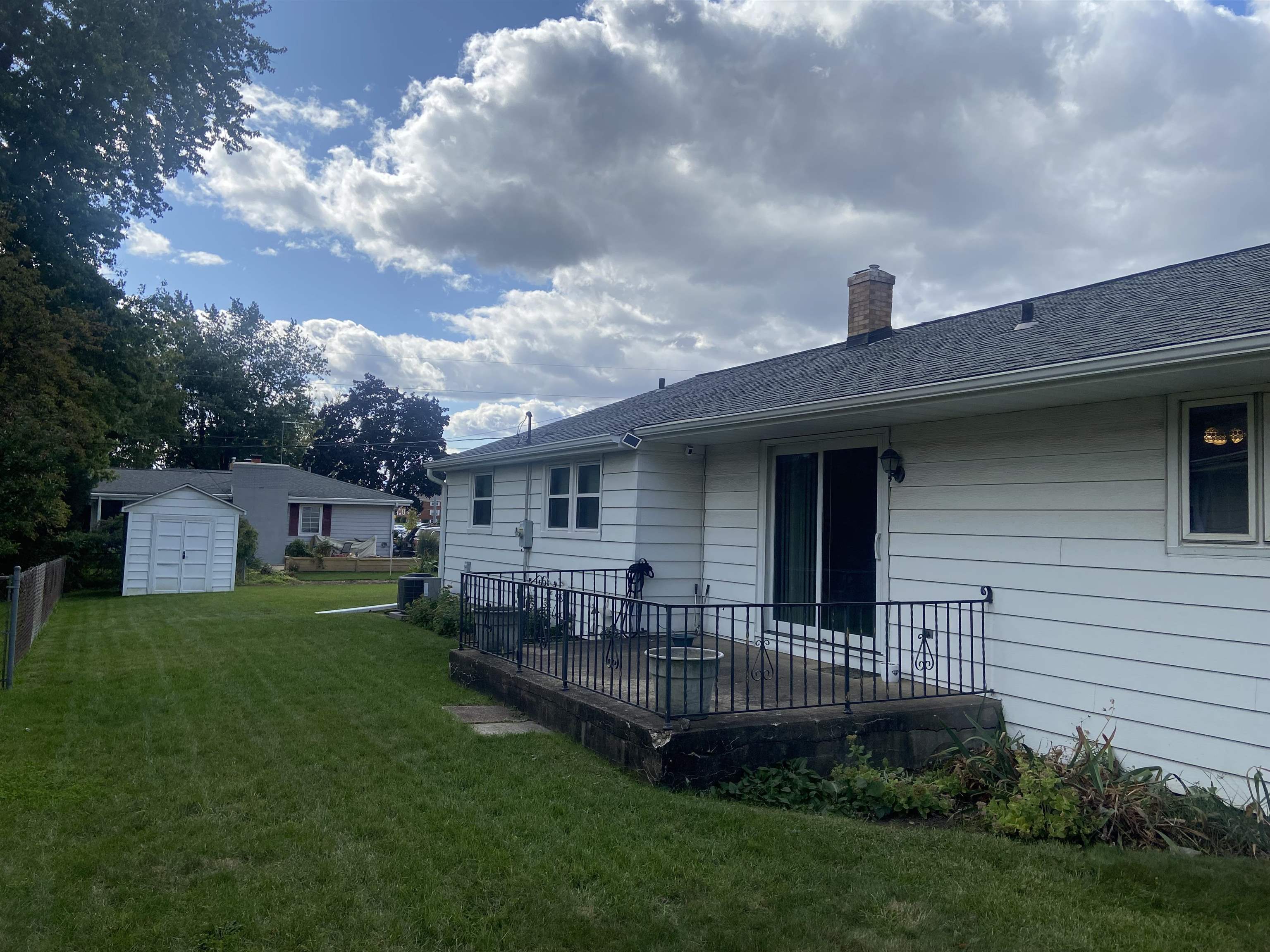 2006 South Alpine Road Rockford, IL 61108 - Photo 2 of 15 a view of a house in front of a big yard plants and large trees