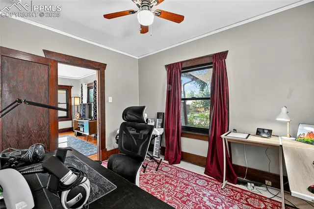 a work room with furniture and a window