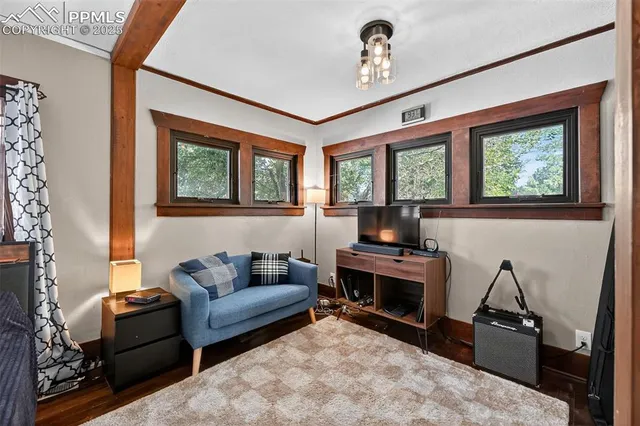 a living room with furniture a window and a fireplace