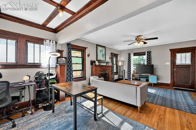 a living room with furniture and a fireplace