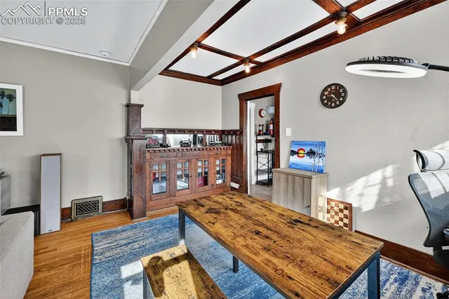 a living room with furniture and a table