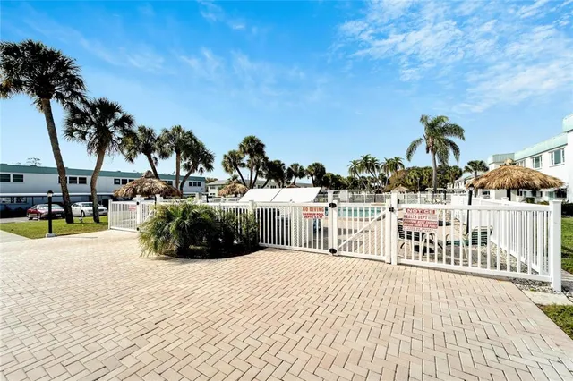 a view of a swimming pool with an outdoor space and seating area