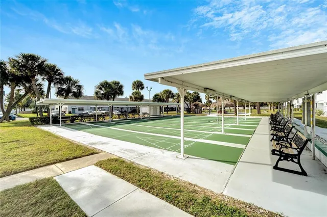 a view of a swimming pool with an outdoor space and seating area