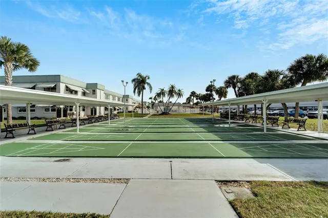 a view of a swimming pool with a table and chairs
