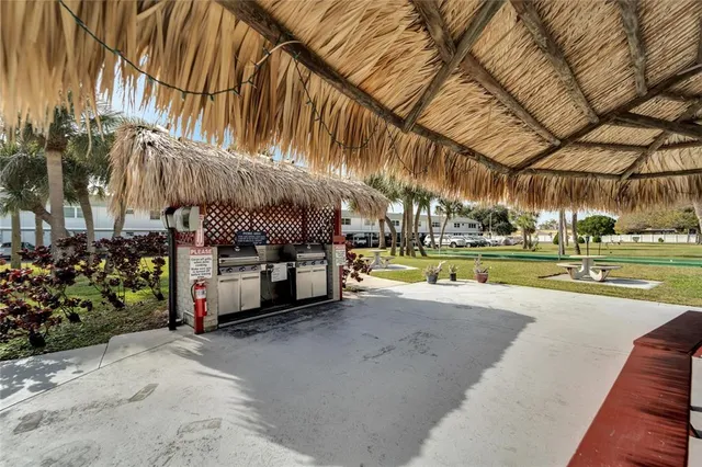 a view of a swimming pool with a table and chairs