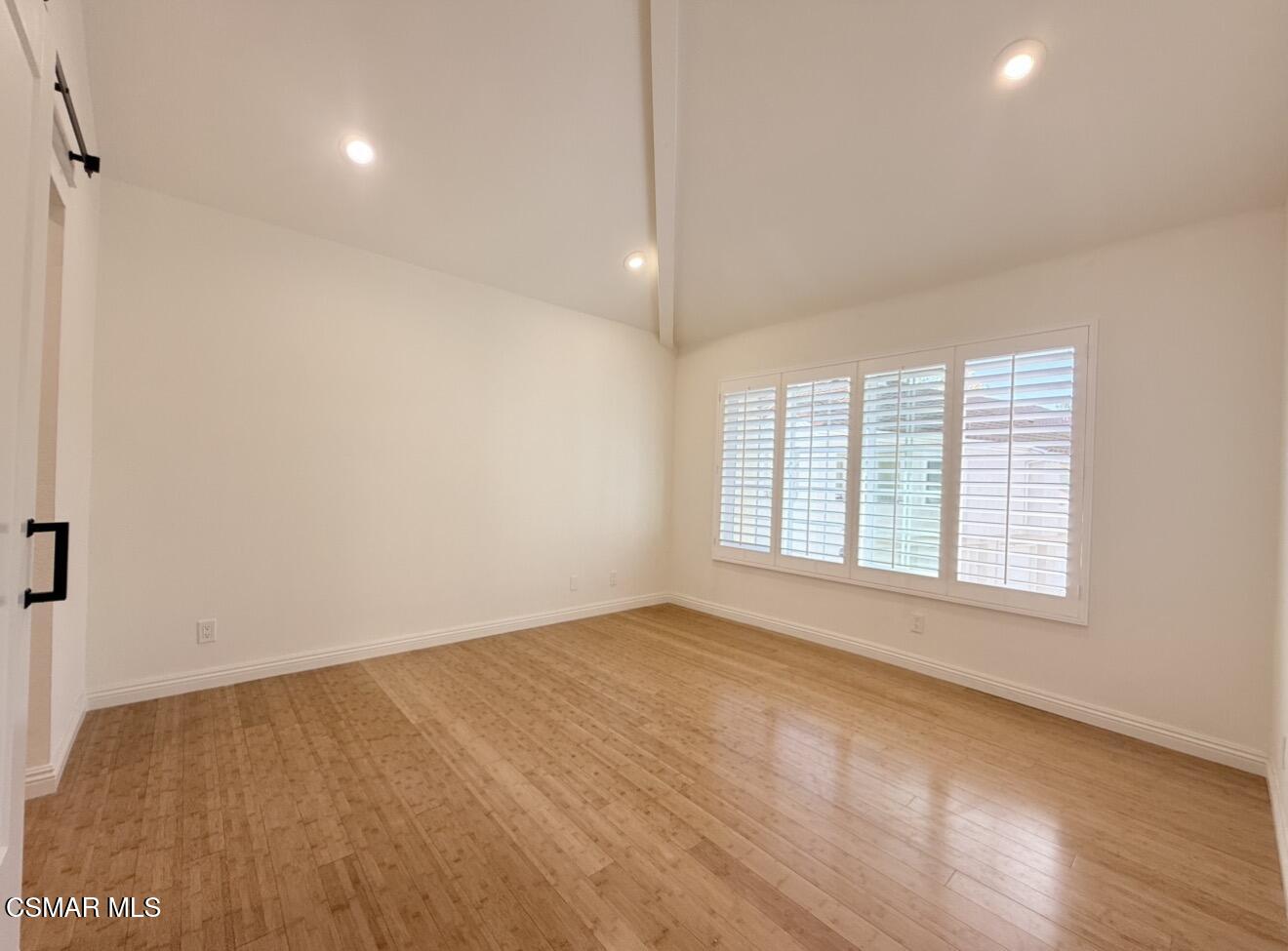 4240 Lost Hills Road, Unit 3107 Agoura Hills, CA 91301 - Photo 16 of 21 an empty room with wooden floor and windows