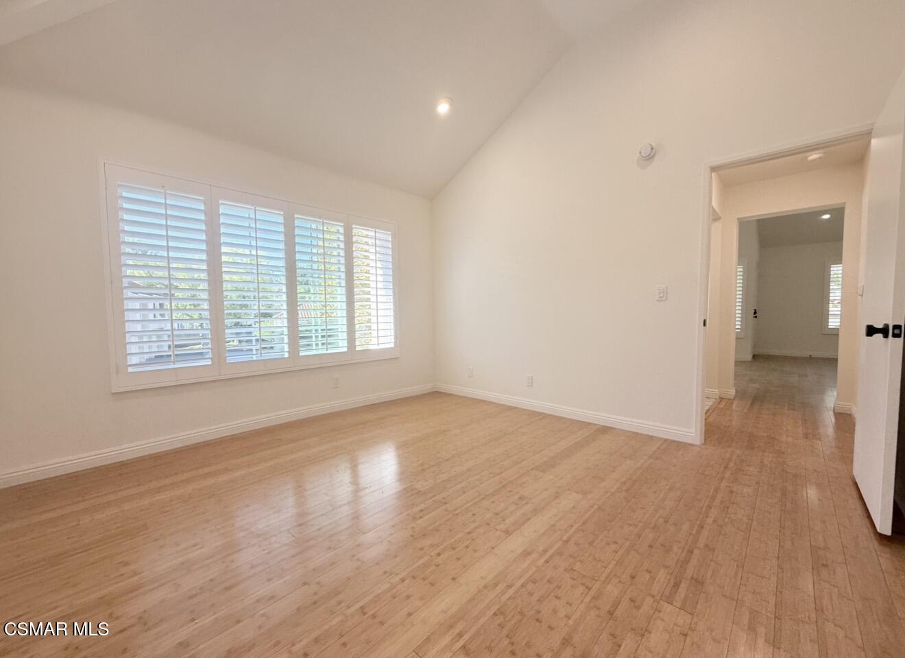 4240 Lost Hills Road, Unit 3107 Agoura Hills, CA 91301 - Photo 21 of 21 an empty room with wooden floor and windows