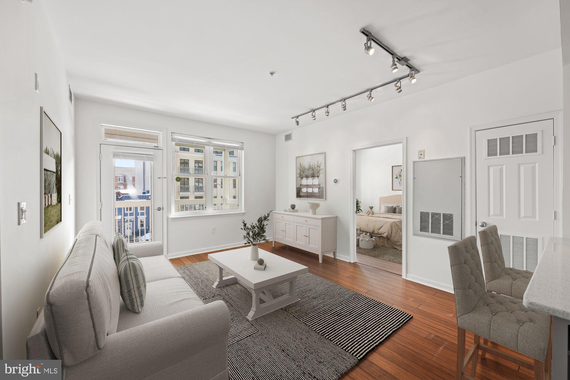 2004 11th Street Northwest, Unit 222 Washington, DC 20001 - Photo 2 of 14 a living room with furniture rug and wooden floor