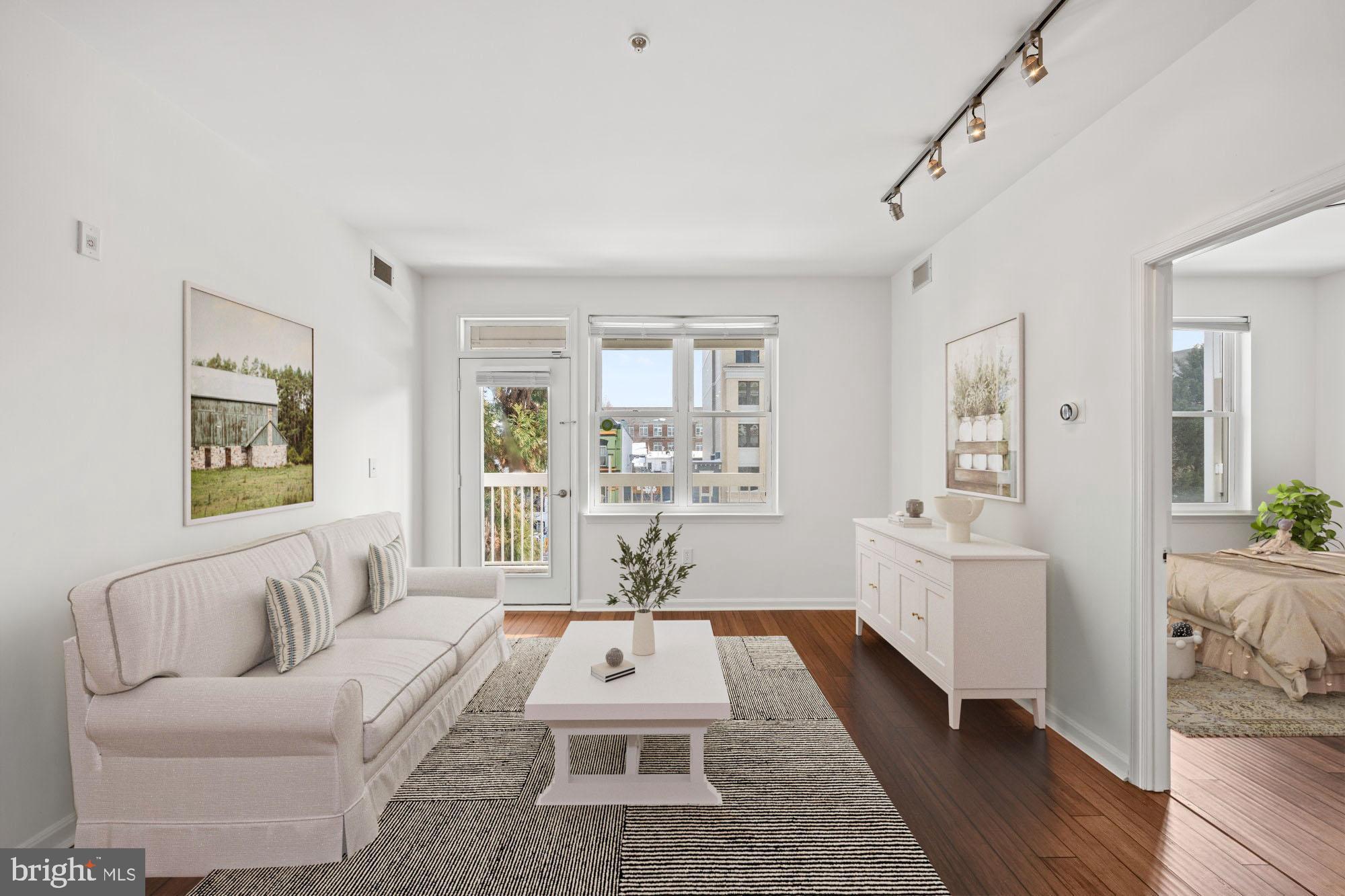 2004 11th Street Northwest, Unit 222 Washington, DC 20001 - Photo 3 of 14 a living room with furniture and wooden floor