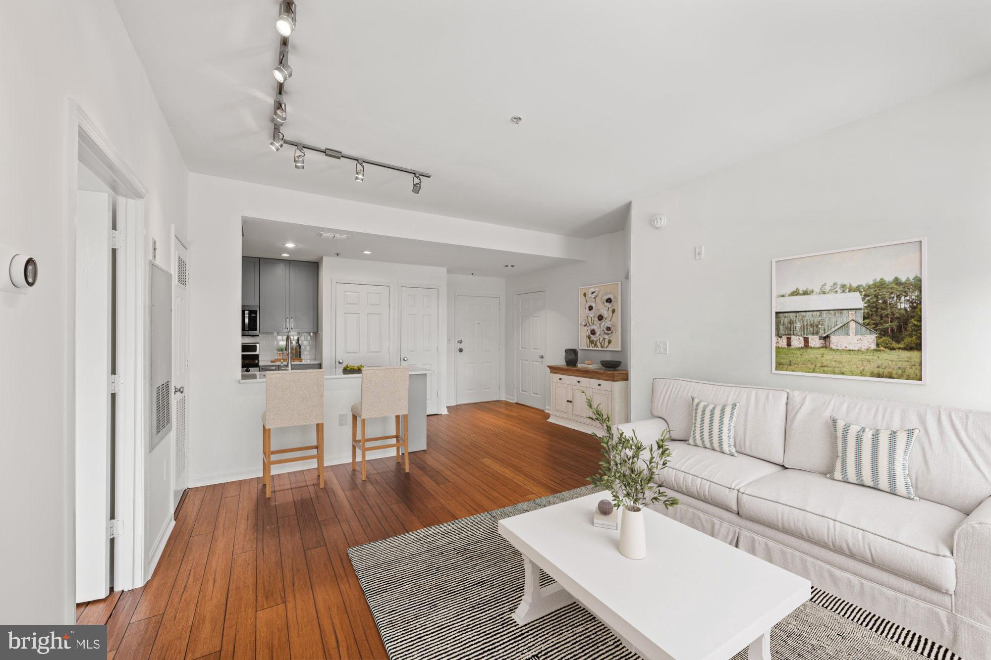 2004 11th Street Northwest, Unit 222 Washington, DC 20001 - Photo 5 of 14 a living room with furniture and a wooden floor