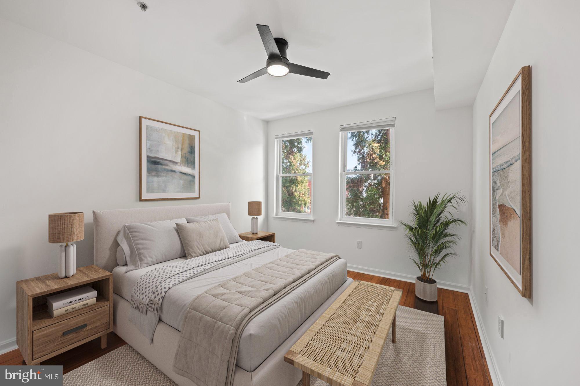 2004 11th Street Northwest, Unit 222 Washington, DC 20001 - Photo 6 of 14 a bedroom with a large bed and a window