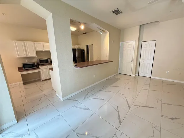 a view of a kitchen with a sink