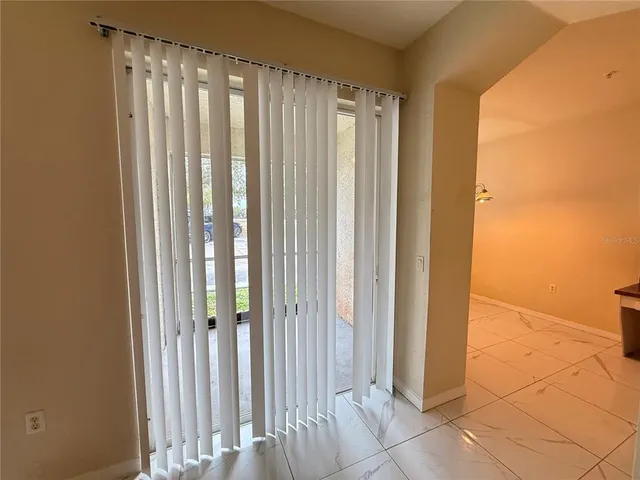 a kitchen with stainless steel appliances granite countertop a stove a refrigerator and a sink