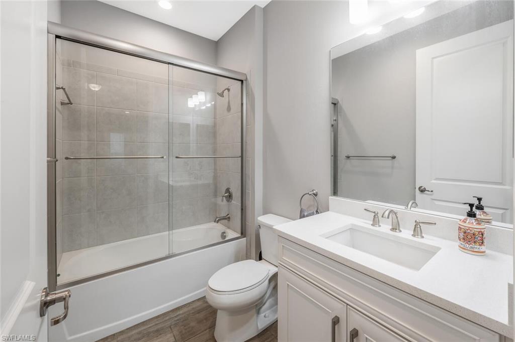 2167 Marquesa Circle Naples, FL 34112 - Photo 14 of 21 a bathroom with a sink toilet and shower