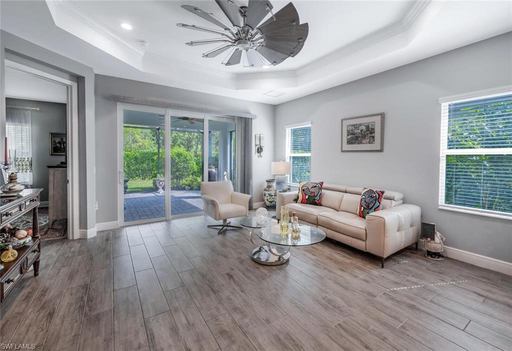 2167 Marquesa Circle Naples, FL 34112 - Photo 3 of 21 a living room with furniture and a large window