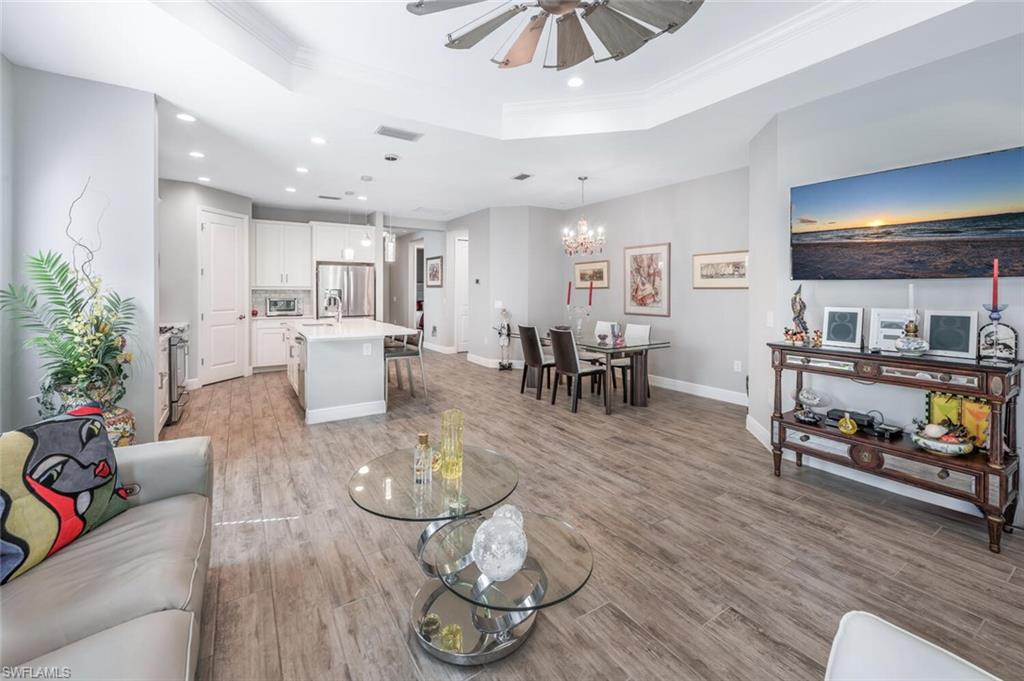 2167 Marquesa Circle Naples, FL 34112 - Photo 6 of 21 a living room with furniture and wooden floor