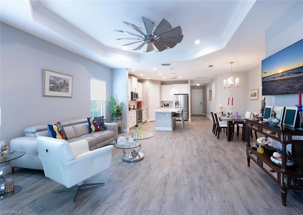 2167 Marquesa Circle Naples, FL 34112 - Photo 8 of 21 a living room with furniture kitchen view and a dining table