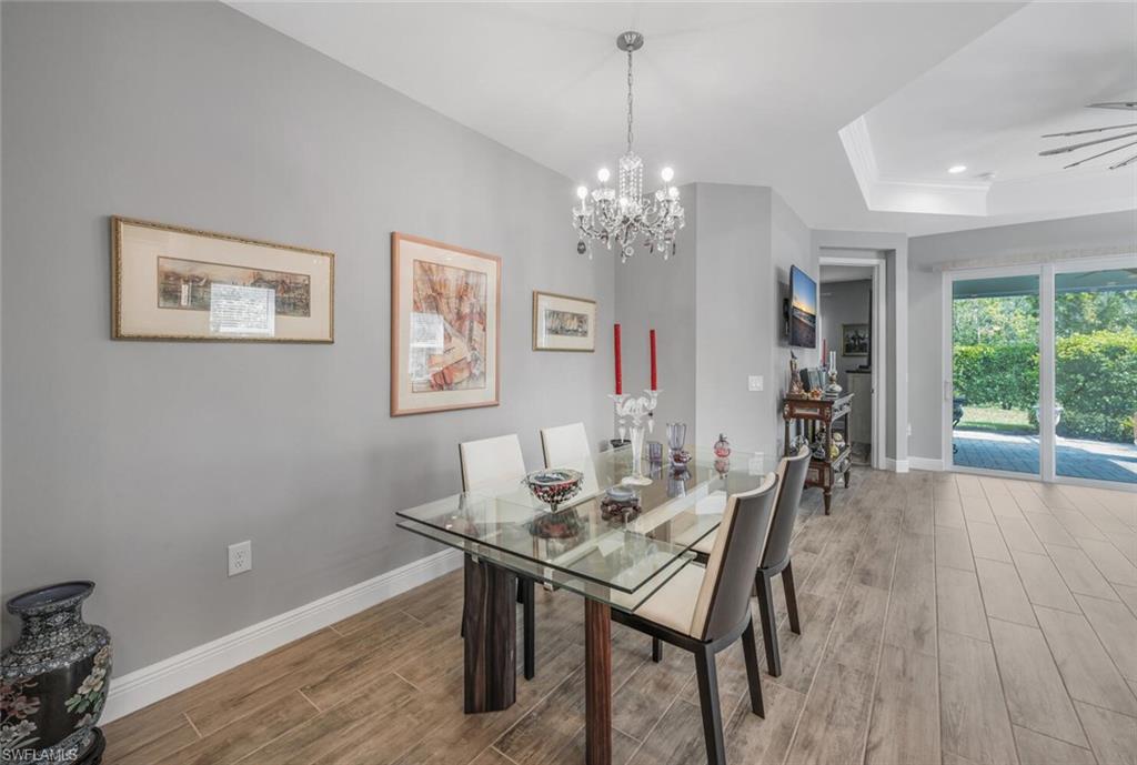 2167 Marquesa Circle Naples, FL 34112 - Photo 9 of 21 a view of a dining room with furniture window and outside view