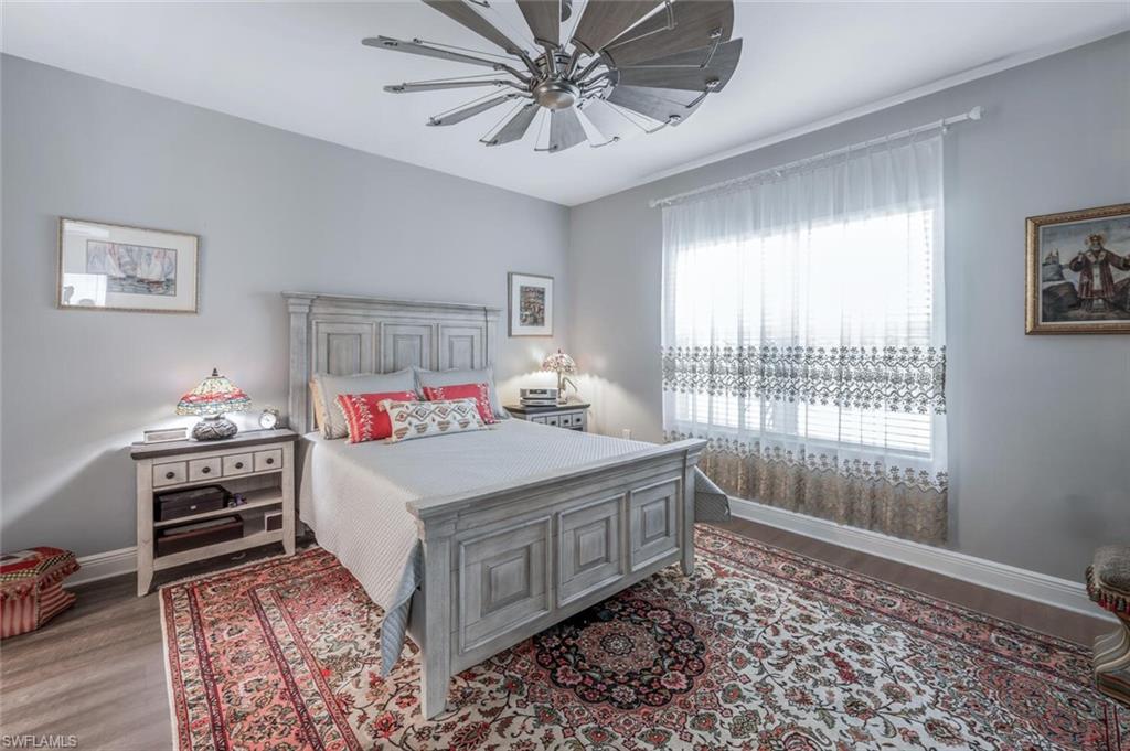 2167 Marquesa Circle Naples, FL 34112 - Photo 10 of 21 a room that has a bed and a window in it