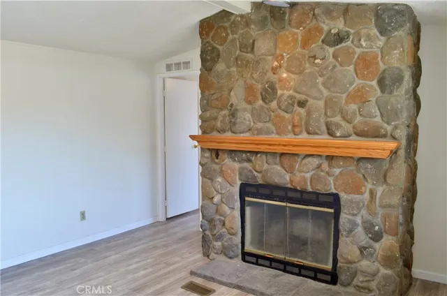 a fireplace with wooden floor