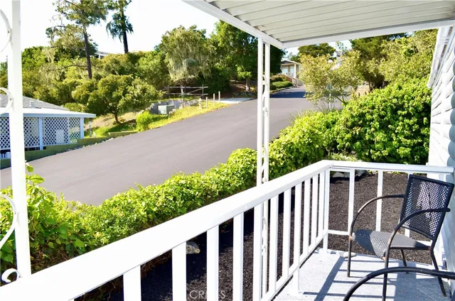 a balcony with trees in front of it