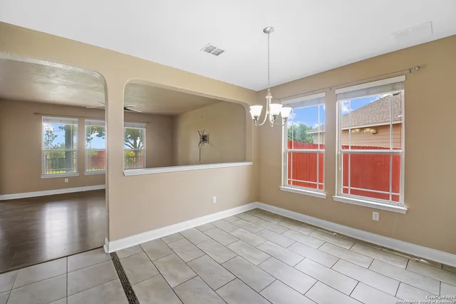 a view of a dining room with furniture window and outside view