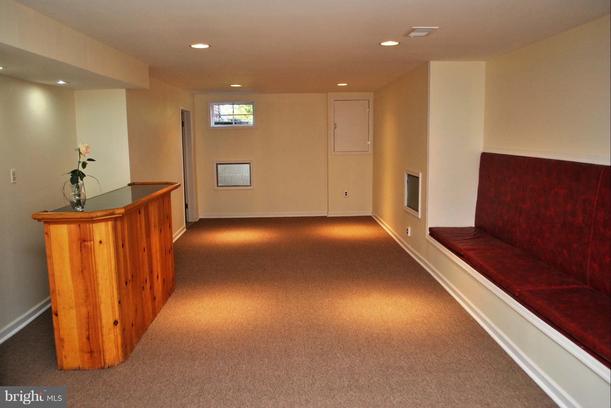 9018 Walden Road Silver Spring, MD 20901 - Photo 21 of 27 Family Room w/ Bench Seating and Bar