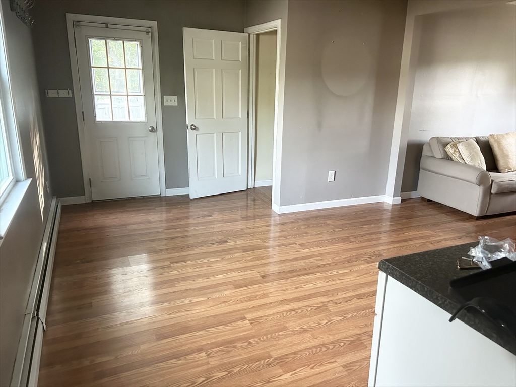 36 Boston Road North Billerica, MA 01862 - Photo 13 of 17 an empty room with wooden floor and windows