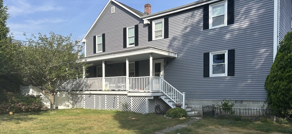 36 Boston Road North Billerica, MA 01862 - Photo 14 of 17 a front view of a house with a yard