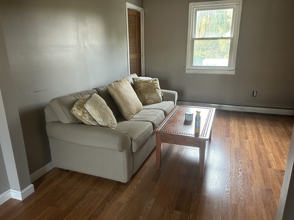 36 Boston Road North Billerica, MA 01862 - Photo 15 of 17 a living room with furniture and wooden floor