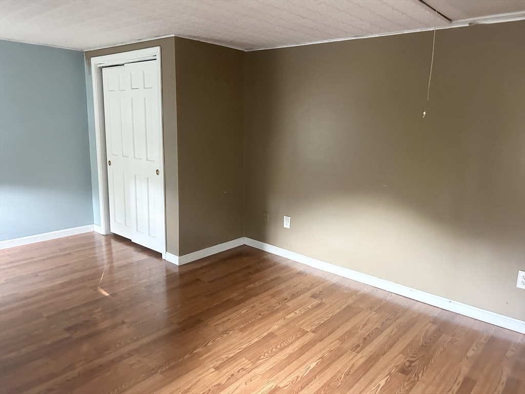 36 Boston Road North Billerica, MA 01862 - Photo 16 of 17 a view of an empty room with wooden floor