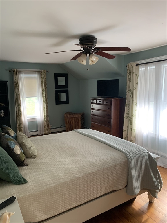 36 Boston Road North Billerica, MA 01862 - Photo 3 of 17 a bedroom with a bed and a chandelier