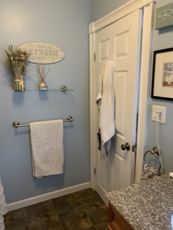 36 Boston Road North Billerica, MA 01862 - Photo 6 of 17 wooden floor with view of bathroom