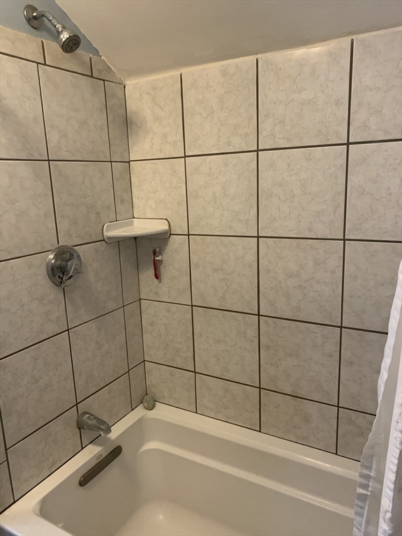 36 Boston Road North Billerica, MA 01862 - Photo 8 of 17 a bathroom with a shower and a bath tub