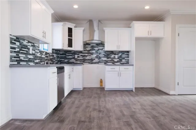 a kitchen with granite countertop a stove and a sink