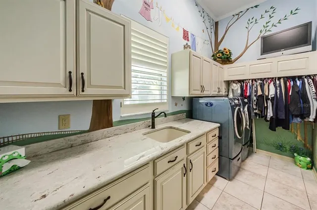 a kitchen with a sink and cabinets