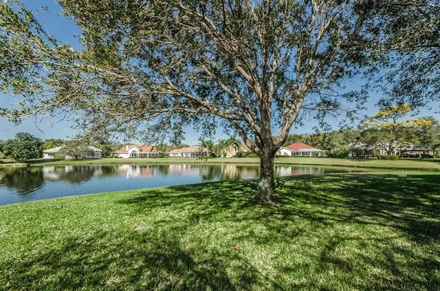 a view of lake with a yard