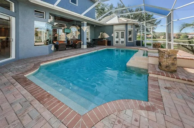 a view of a patio with table and chairs