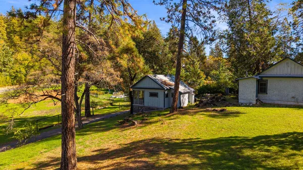a backyard of a house with lots of green space