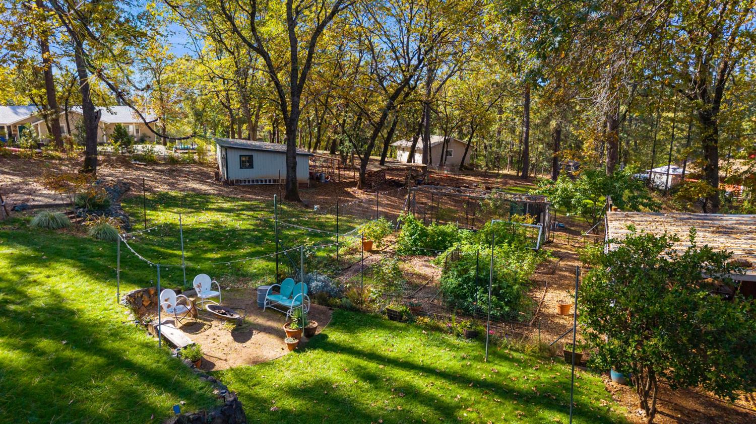 790 Pine Knoll Road Applegate, CA 95703 - Photo 50 of 81 a backyard of a house with lots of green space and fountain
