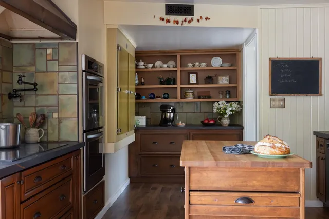 a view of a dining room with furniture and window