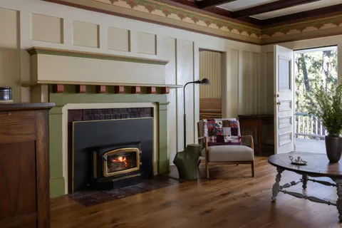 a front view of a house with a yard table and chairs