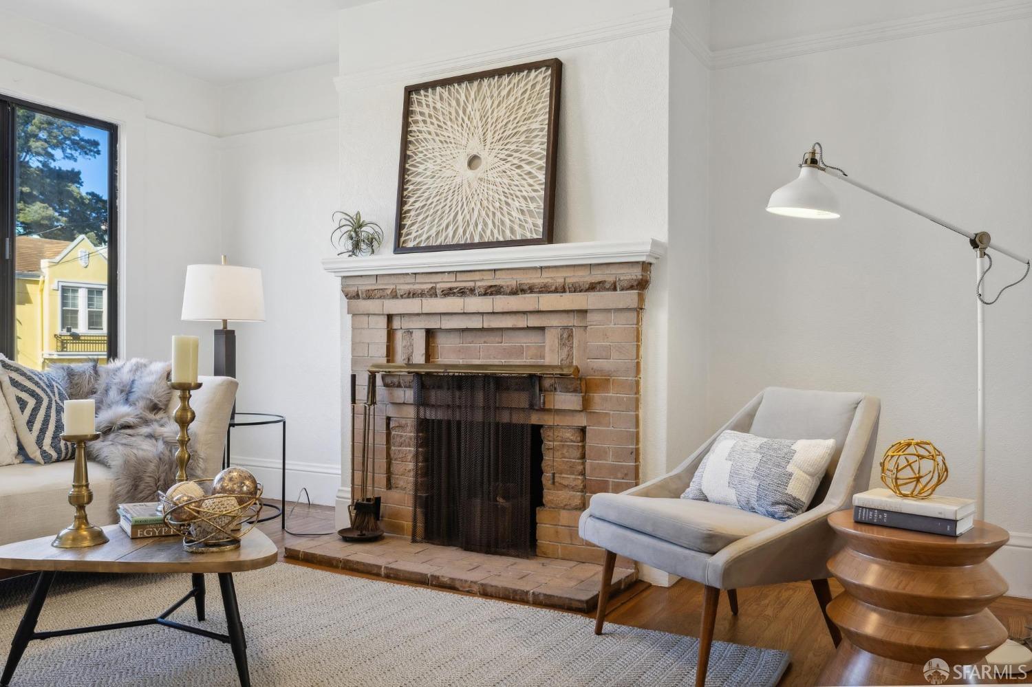 686 29th Avenue San Francisco, CA 94121 - Photo 15 of 69 a living room with furniture and a fireplace