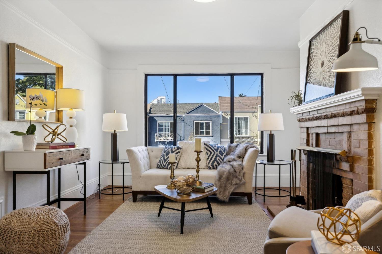 686 29th Avenue San Francisco, CA 94121 - Photo 19 of 69 a living room with furniture fireplace and a flat screen tv