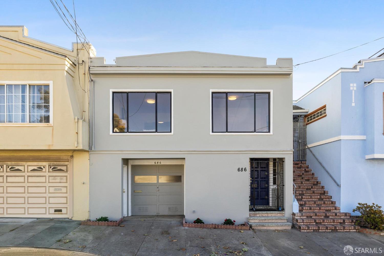 686 29th Avenue San Francisco, CA 94121 - Photo 2 of 69 a front view of a house with a garage