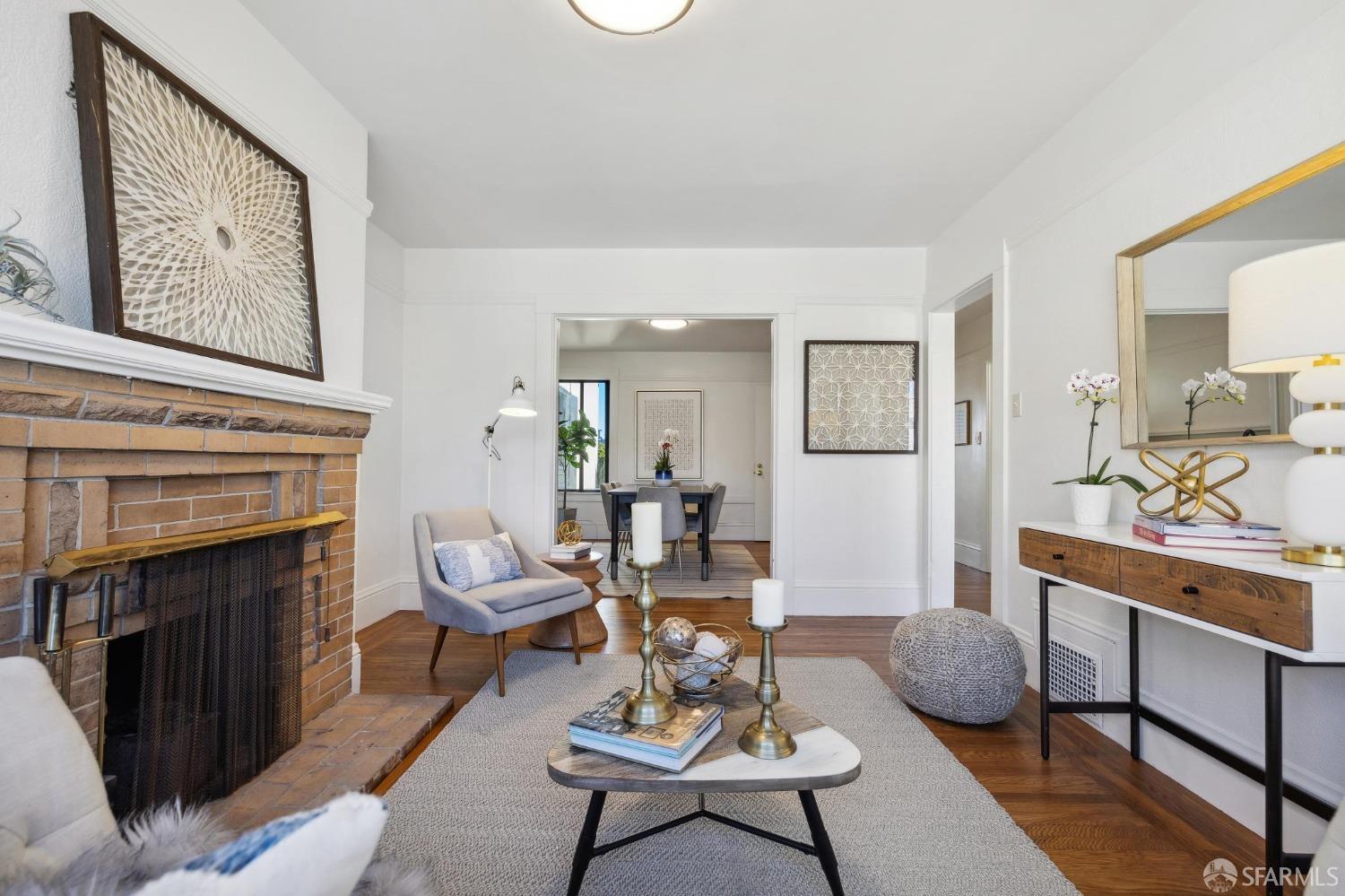 686 29th Avenue San Francisco, CA 94121 - Photo 25 of 69 a living room with furniture and a fireplace