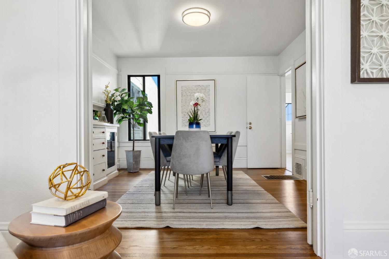 686 29th Avenue San Francisco, CA 94121 - Photo 26 of 69 a view of a dining room with furniture and a potted plant